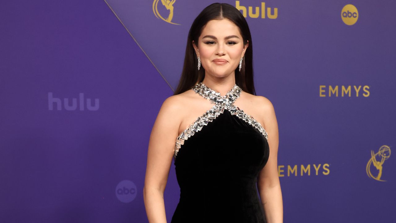 Selena Gomez at the 2024 Emmys wears a black gown with silver embellishments on the neckline.