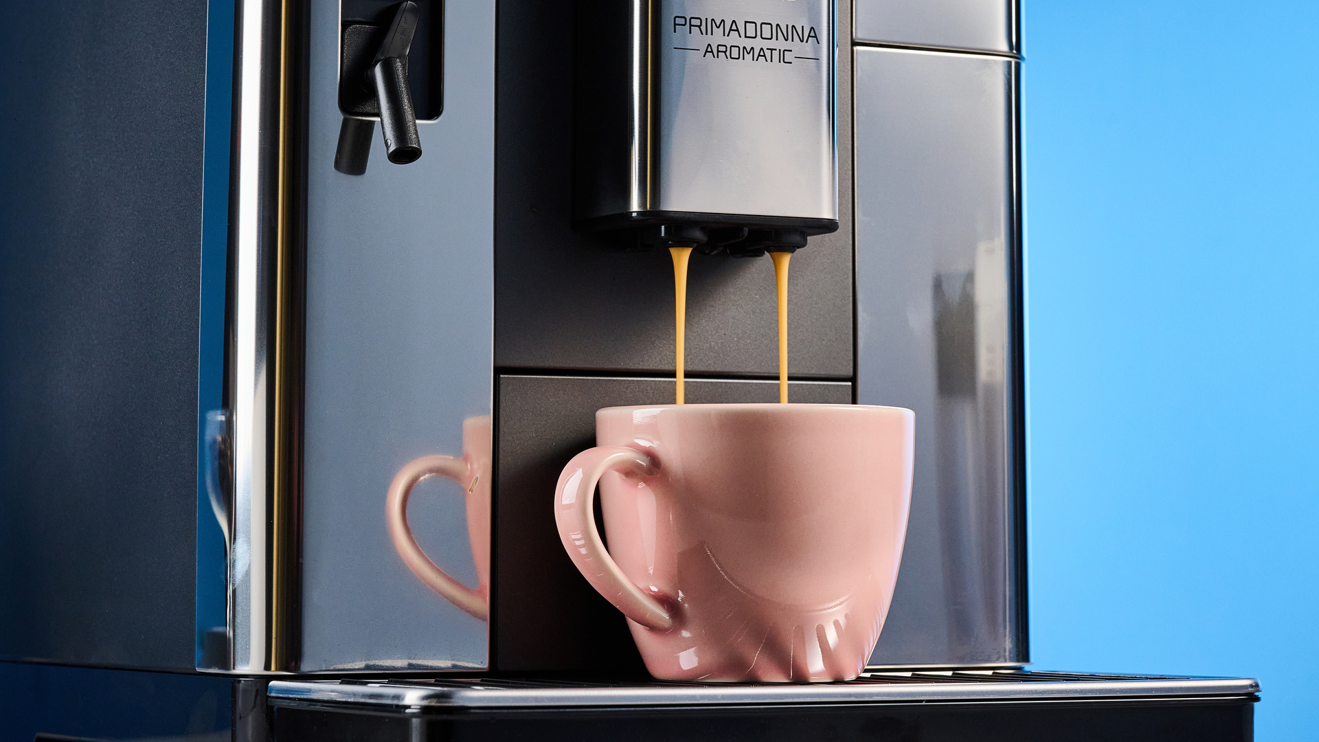 the de'longhi primadonna aromatic photographed against the blue tom's guide background