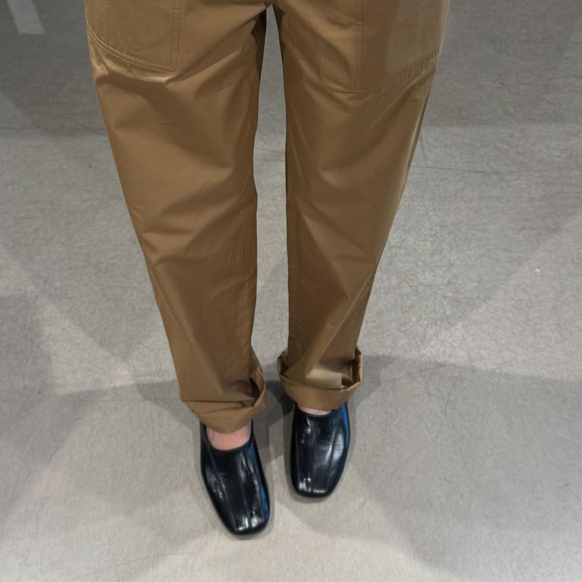 @annabelrosendahl wearing khaki trousers with Phoebe Philo's Club Slipper high vamp pump shoe trend. 