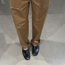 @annabelrosendahl wearing khaki trousers with Phoebe Philo's Club Slipper high vamp pump shoe trend. 