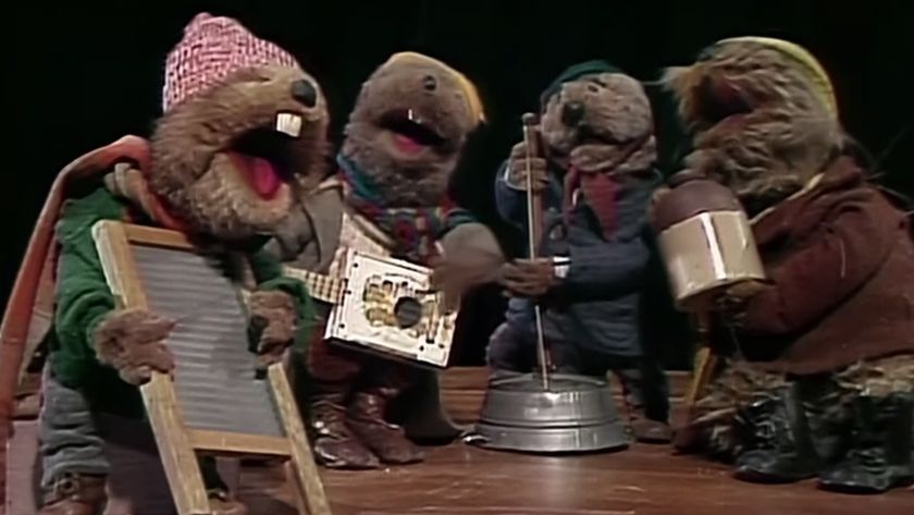 Emmet and his jug-band playing on stage in Emmet Otter&#039;s Jug-Band Christmas