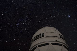The Orion constellation as seen over the Mayall 4-meter Telescope on Kitt Peak, in southern Arizona.