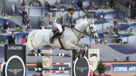 Simon Delestre jumping grey Gatsby in a GCT competition