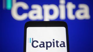 Capita logo displayed on a smartphone screen with company branding in background.