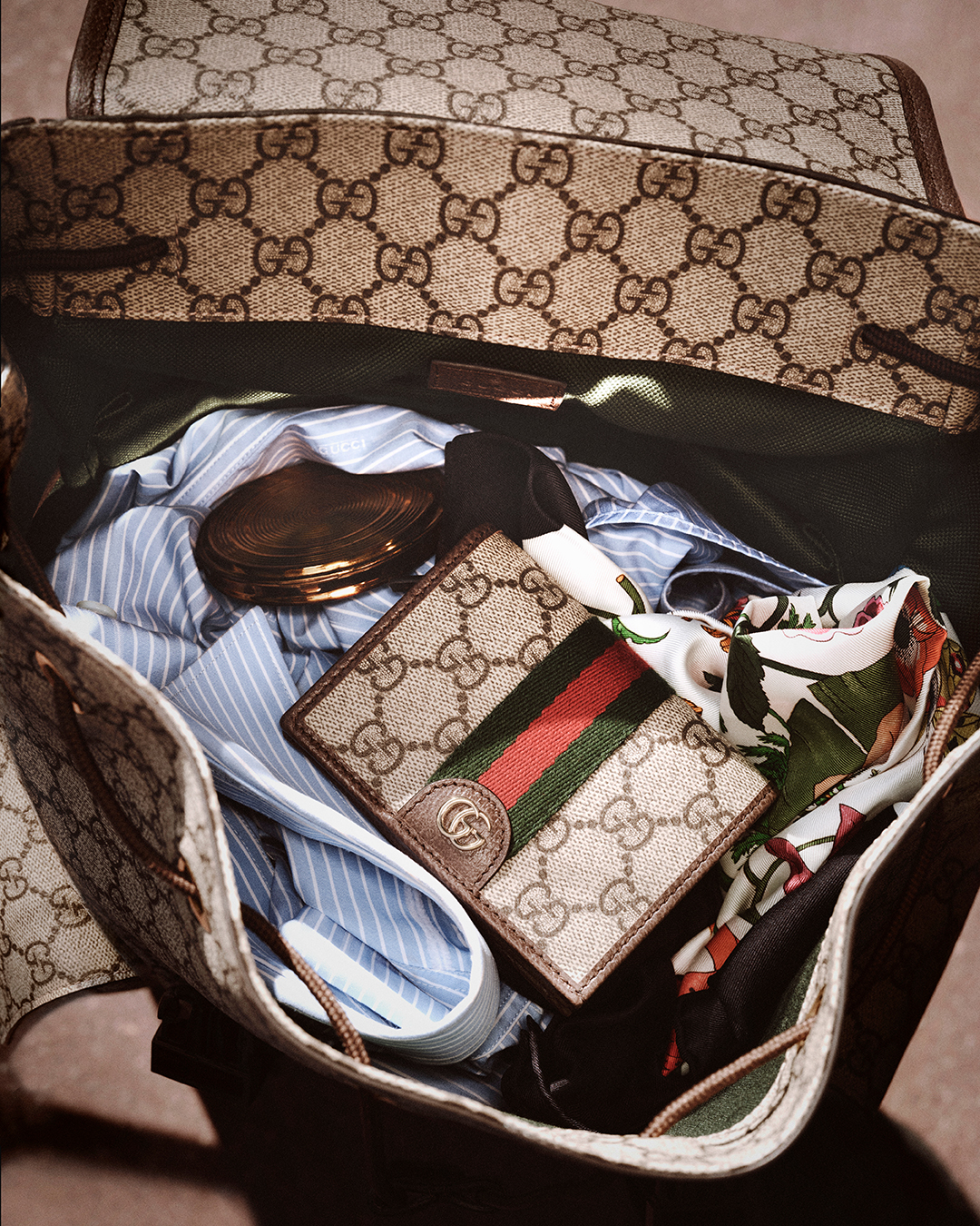 Gucci monogram bag in the new Gucci campaign.