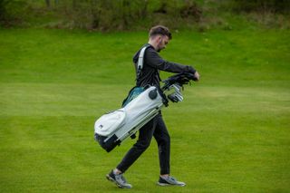 Dan Parker carrying the MNML MV2 stand bag on course
