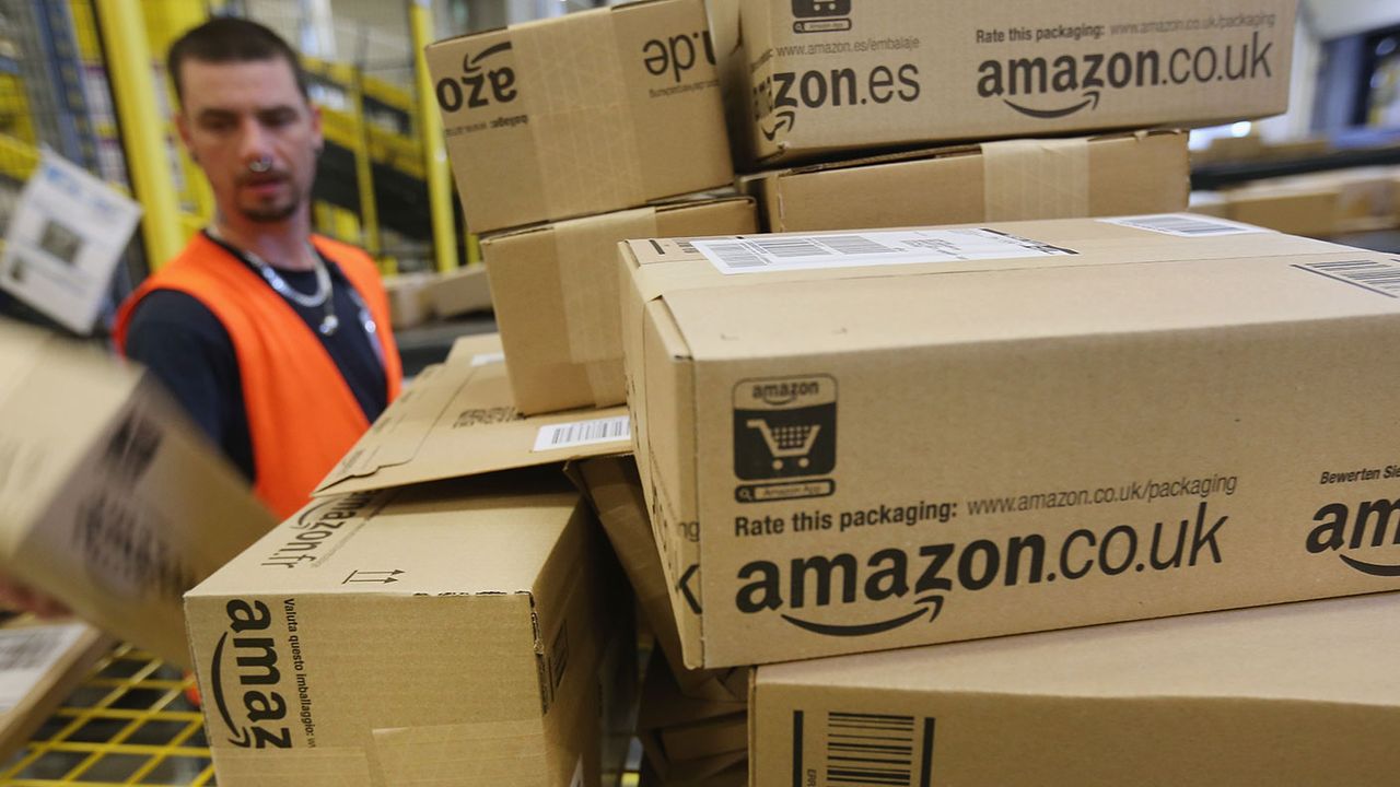 Amazon warehouse worker with boxes 