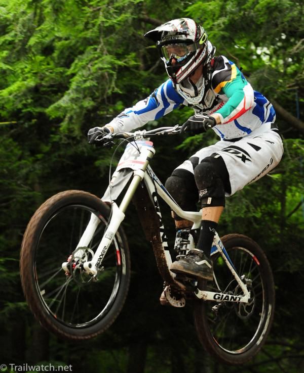 Andrew Neething (Giant Factory Team) flying over a fire road