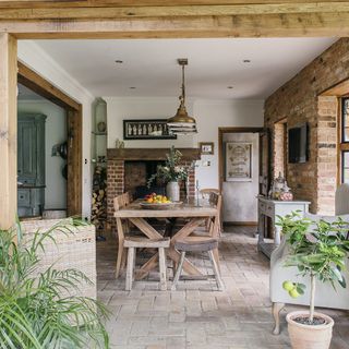 A rustic dining room in a conservatory style extension