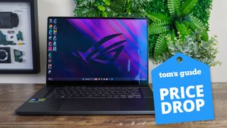 Asus ROG Zephyrus G16 on table with Tom's Guide Price Drop badge