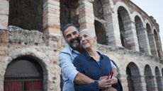 A retired couple on vacation in Verona, Italy.