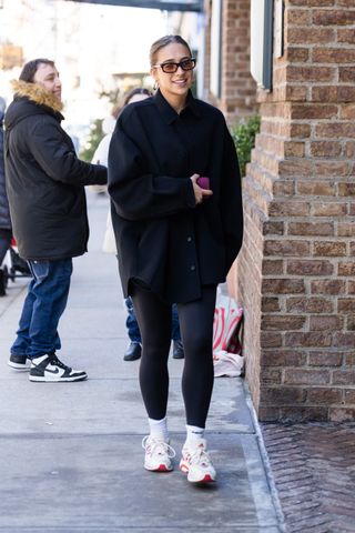 Tate McRae wearing black leggings in New York.