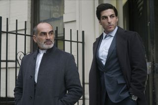 Javad and Abbas stand outside a building in The Night Agent season 2