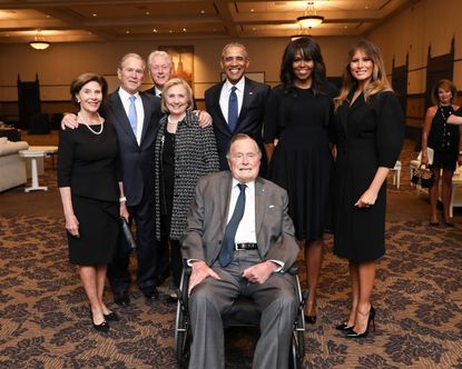 Former first families stand with first lady Melania Trump and former President George H.W. Bush