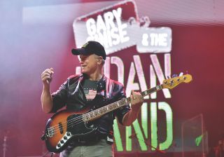 Gary Sinise of the Lt. Dan Band performs as part of a Salute to the Troops event at the Fremont Street Experience on November 9, 2019 in Las Vegas, Nevada.