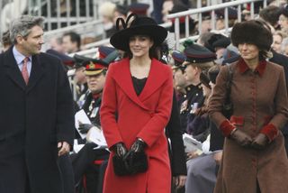 SURREY, ENGLAND - DECEMBER 15: (NO PUBLICATION IN UK MEDIA FOR 28 DAYS) Kate Middleton, Prince William's girlfriend, (C) with her parents Carole and Michael attend the Sovereign's Parade at Sandhurst Military Academy on December 15, 2006 in Surrey, England. Kate and her family were there to watch Prince William's passing-out of the academy. (Photo by POOL/Tim Graham Picture Library/Getty Images)