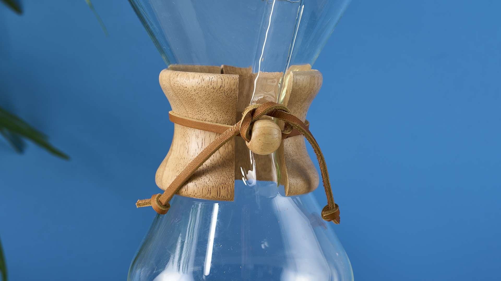 a 6-cup hourglass coffee maker from Chemex and a wooden collar with a rawhide tie