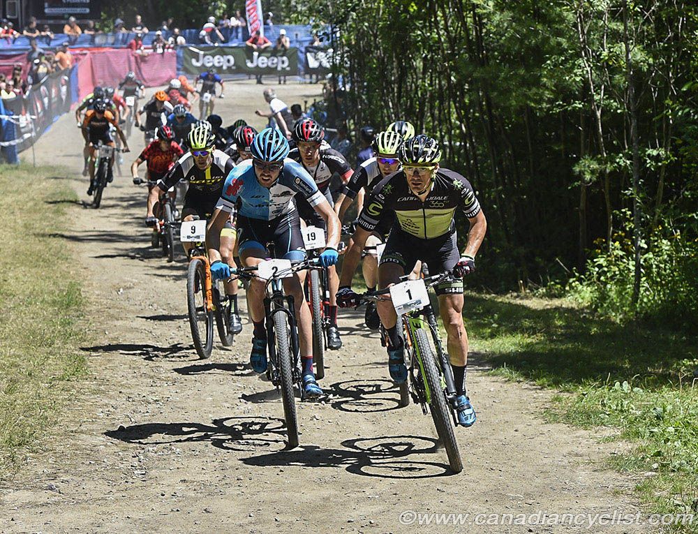 Raphael Gagne (Cannondale 360fly p/b Sugoi) and Leandre Bouchard (Cyclone D'Alma) lead at start
