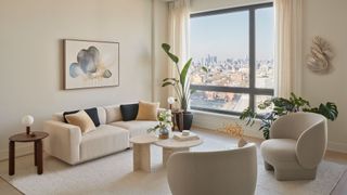 A beige/white sofa with black and yellow cushions