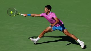 Carlos Alcaraz of Spain plays a forehand against Fabian Marozsan of Hungary in their fourth round match during the BNP Paribas Open at Indian Wells Tennis Garden 