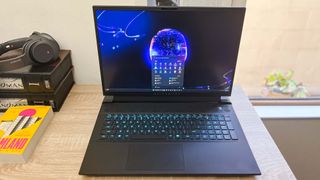 Alienware m18 review unit on desk, Windows 11 running