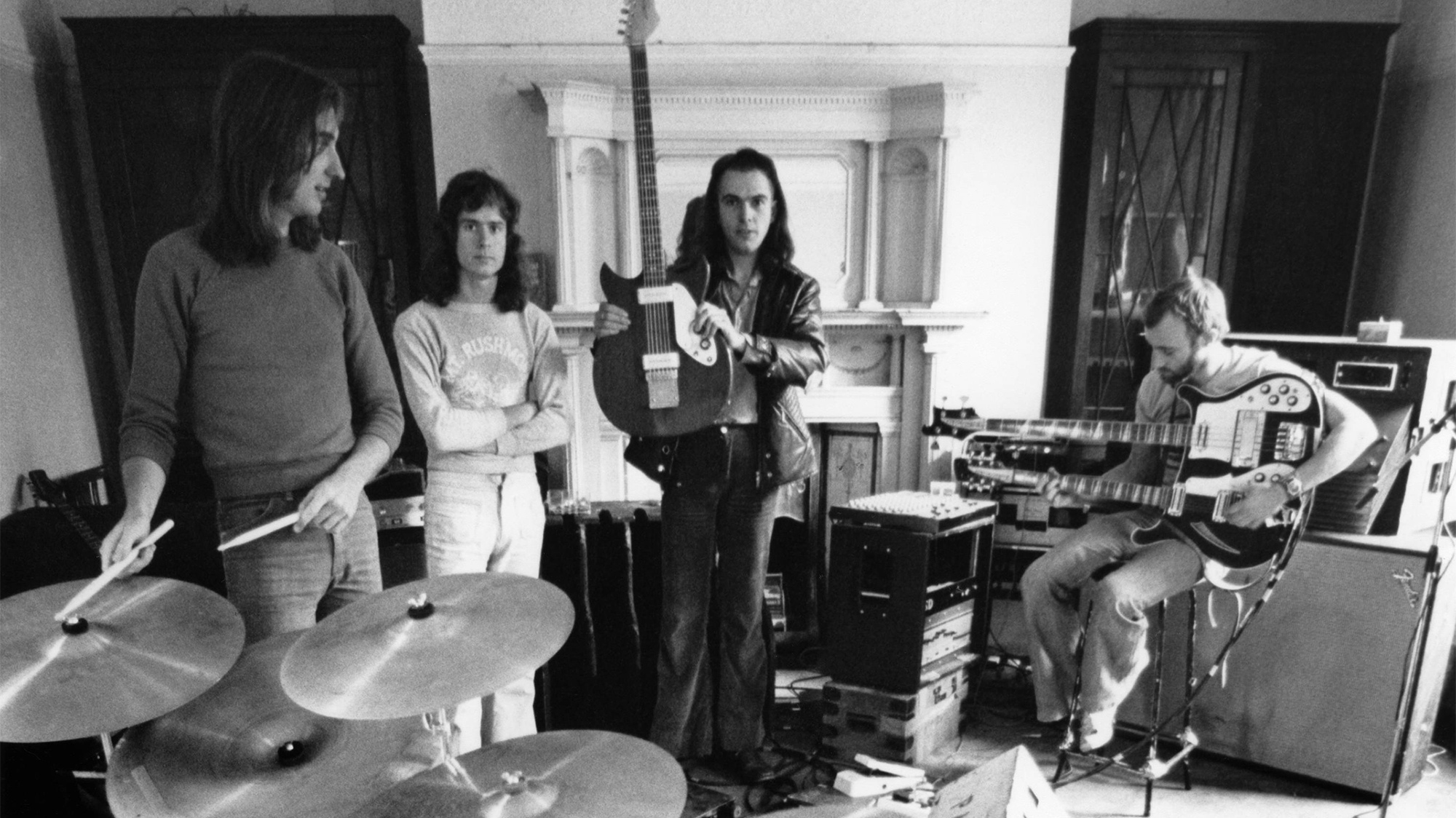 Genesis rehearse in January 1974. (from left) Mike Rutherford, Tony Banks, Peter Gabriel, Phil Collins (Steve Hackett is not present)