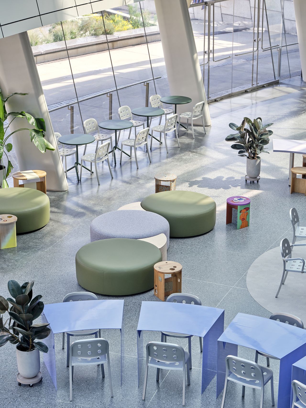 The interiors of the Brooklyn Museum's new cafe feature whimsically shaped furniture in pastel and metal tones.