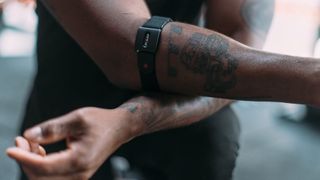 Man wearing Polar Verity Sense heart rate monitor on arm