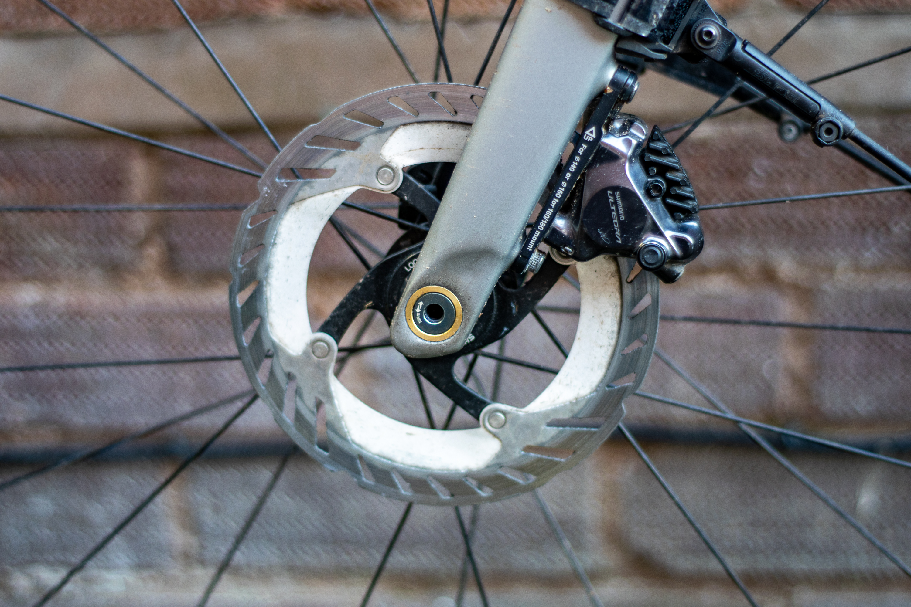 A Shimano brake caliper and rotor