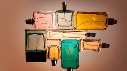 perfume flat lay with clear bottles