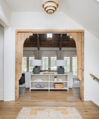 view to living room with wooden detailing around doorway