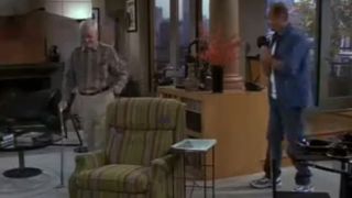 Cast members of Frasier walking around their apartment in the show