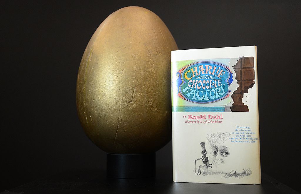 The first edition book &amp;#039;Charlie and the Chocolate Factory&amp;#039; and the original hero Golden Egg from the film &amp;quot;Willy Wonka and the Chocolate Factory&amp;quot;