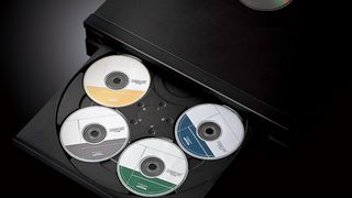 Yamaha CD-C603 close-up with tray open to reveal a wheel of five CDs in the player