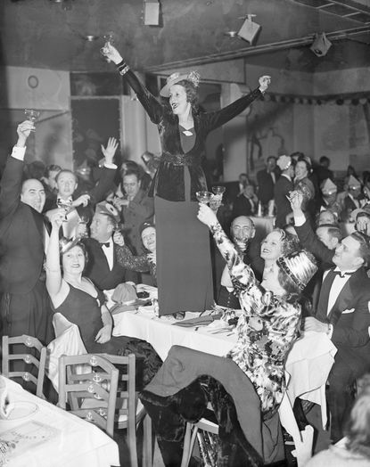 A woman toasts to the new year.