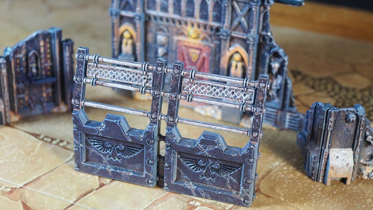 Warhammer pre-painted barriers and ruins on a desert battlefield