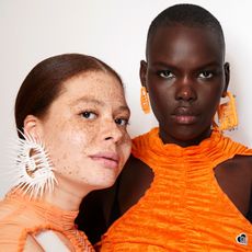 women in orange and white wearing jasmine perfume