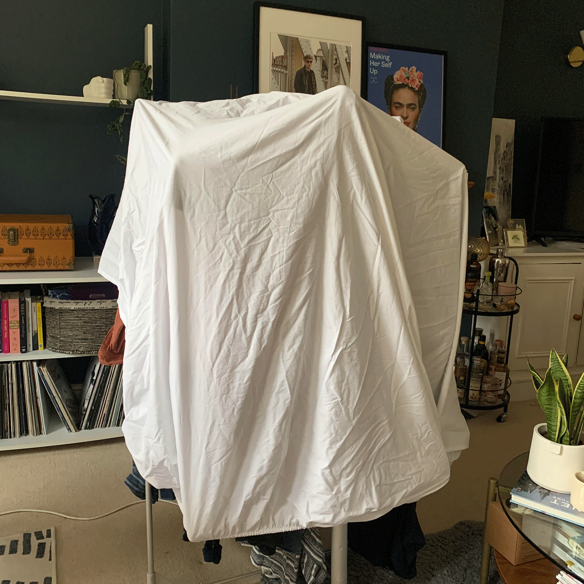 Fitted sheet over a heated airer