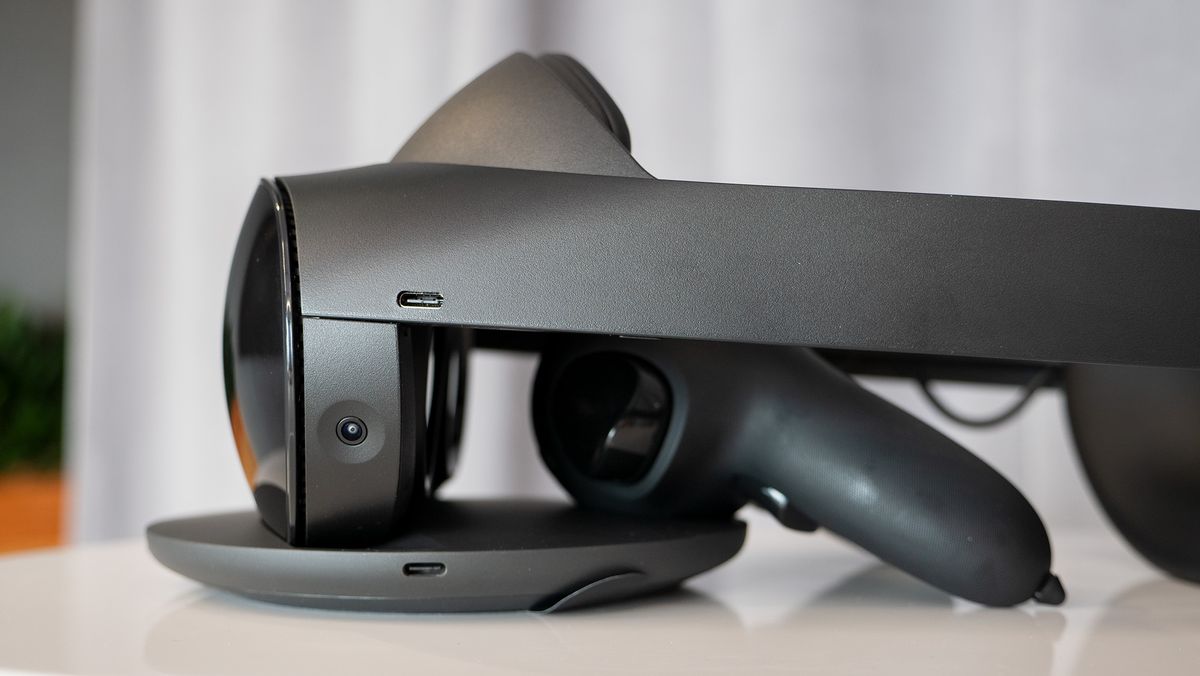 Meta Quest Pro headset with Quest Touch Pro controllers charging on the included dock