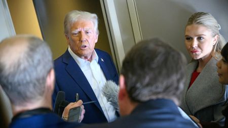 Donald Trump talks to reporters on Air Force One