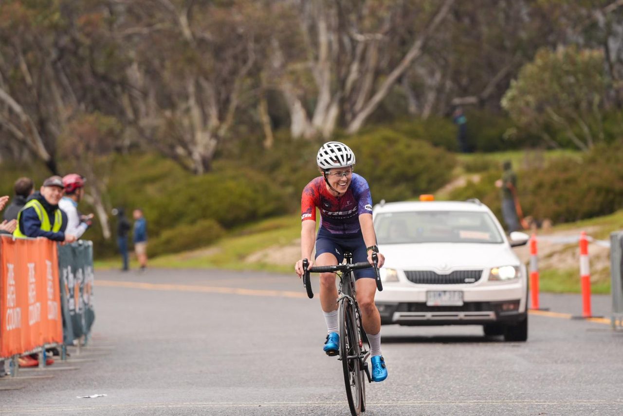Kathryn McInerney (Trek Shimano Australia) with a winning grin on stage 3 of the 2024 Tour of Bright