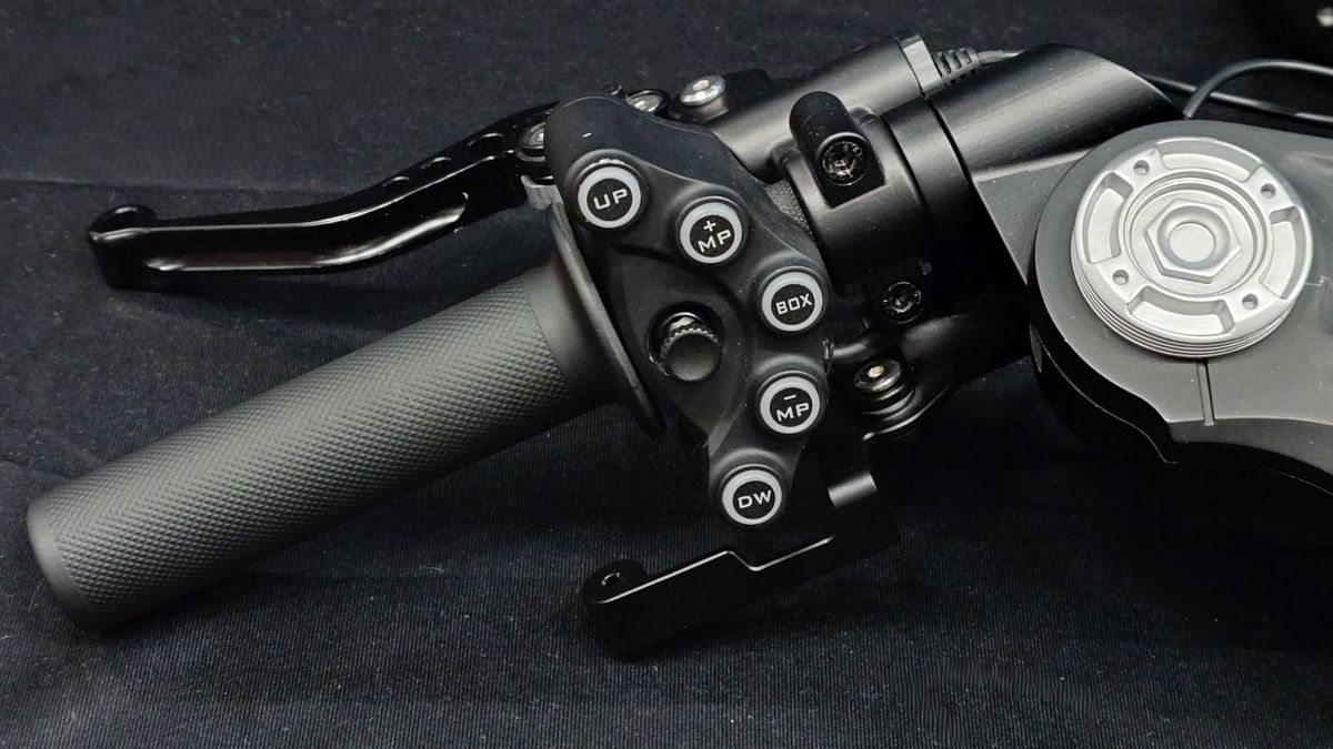 Close up photos of the Moza Racing MotoGP handlebars on a black backdrop.