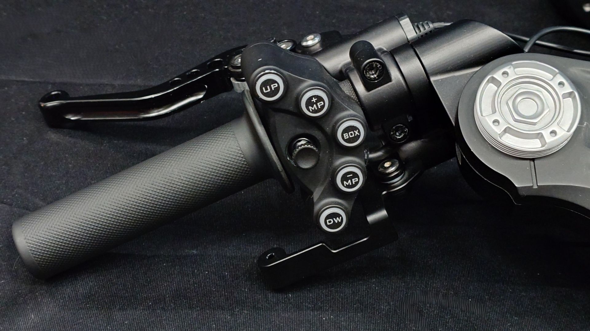 Close up photos of the Moza Racing MotoGP handlebars on a black backdrop.