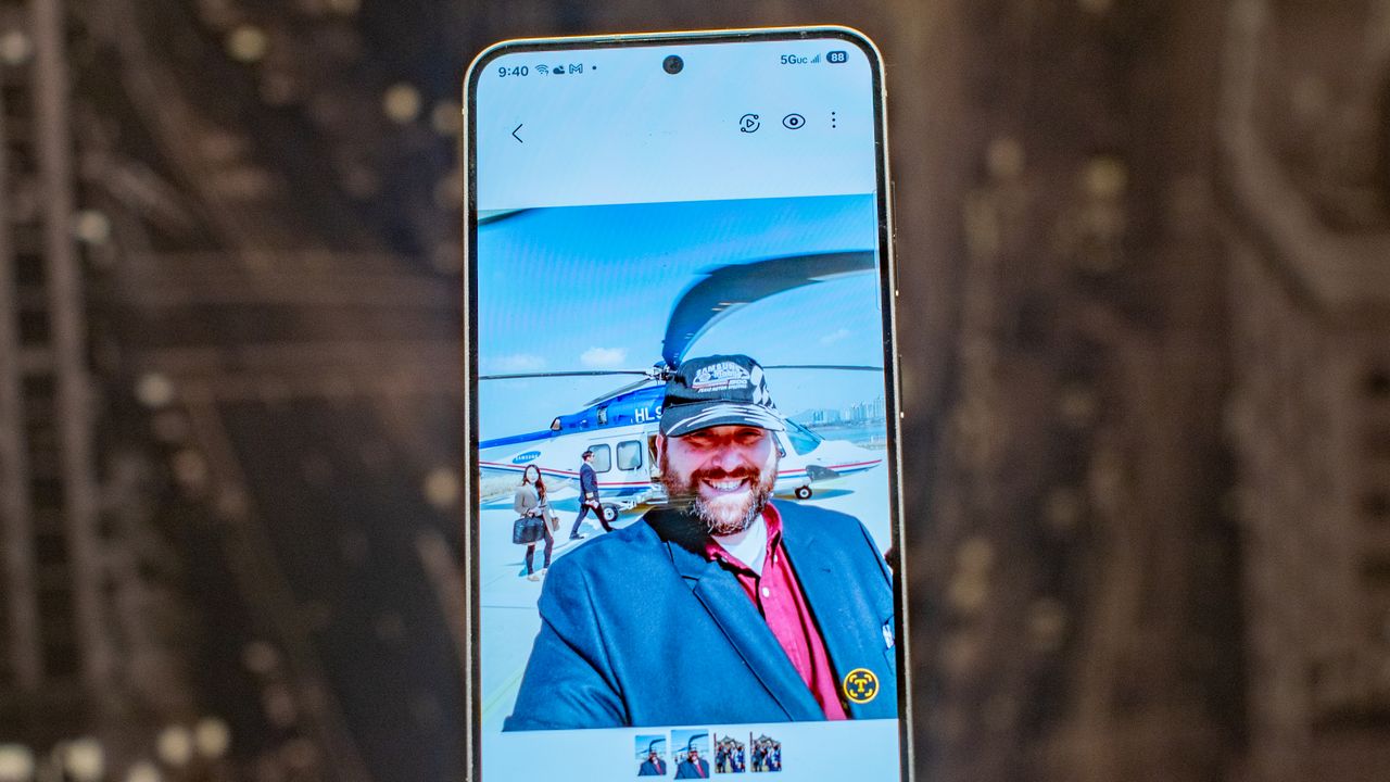 Samsung Galaxy S25 showing a photo of me in front of a helicopter with some random people in the background