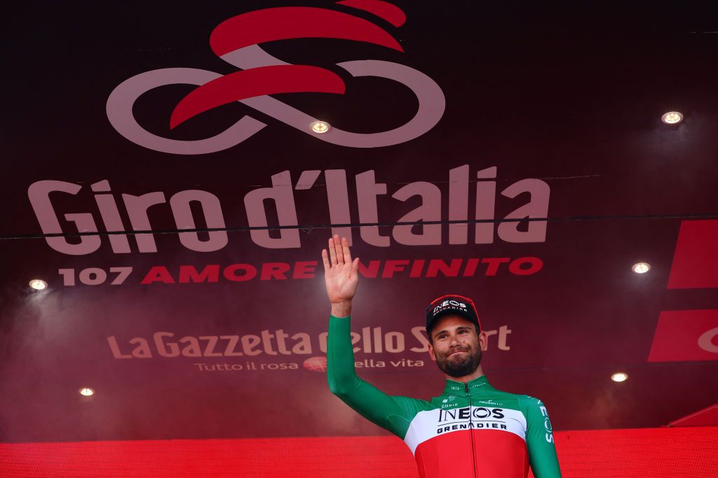 Team Ineos' Italian rider Filippo Ganna celebrates on the podium after winning the 14th stage of the 107th Giro d'Italia cycling race, a time trial between Castiglione delle Stiviere and Desenzano del Garda, on May 18, 2024. (Photo by Luca Bettini / AFP)