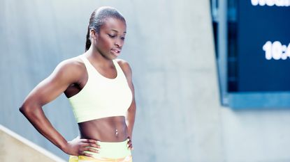 Woman doing a tough workout to offset a sedentary lifestyle