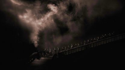 light projection with smoke over grand staircase