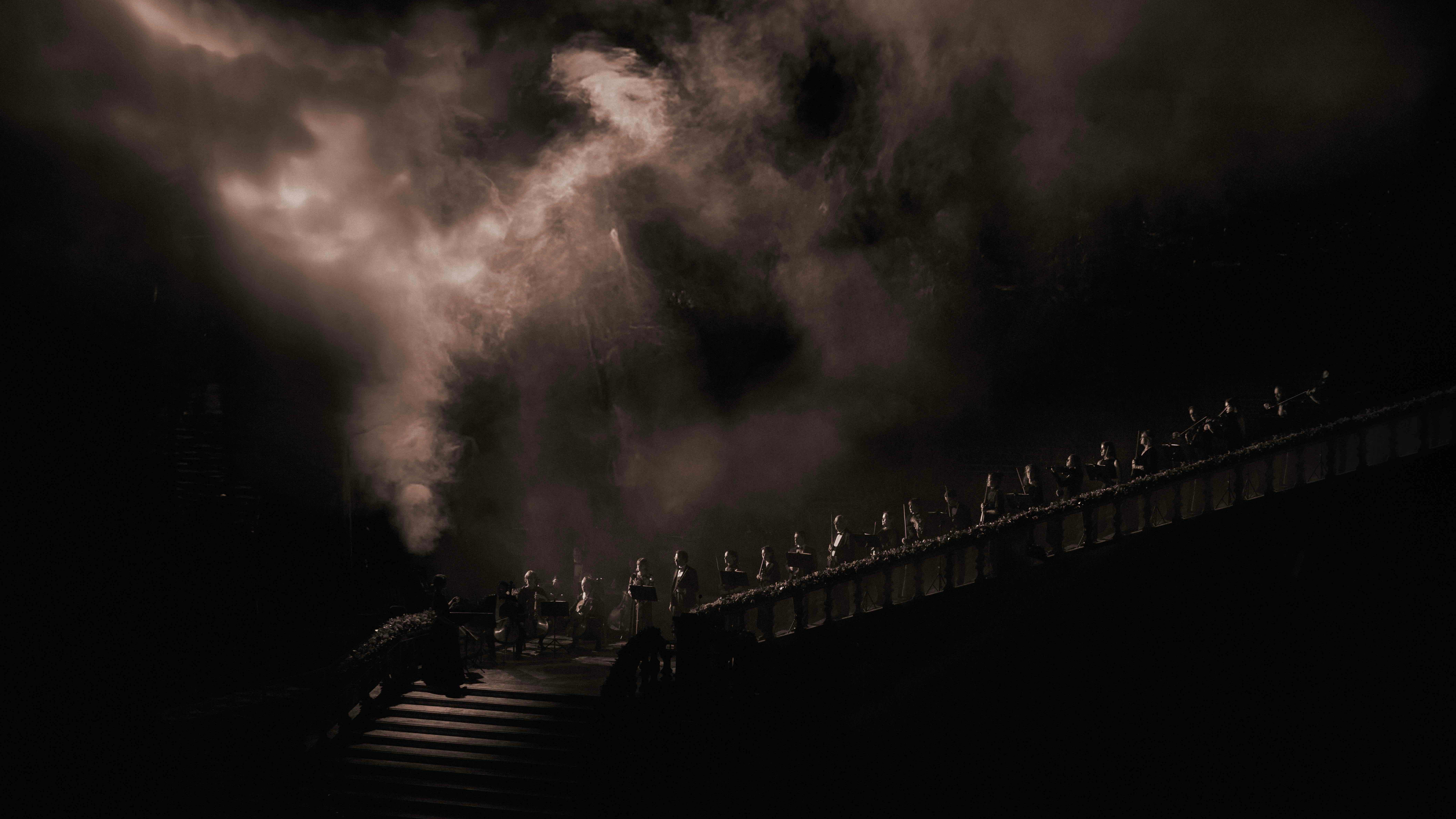 light projection with smoke over grand staircase