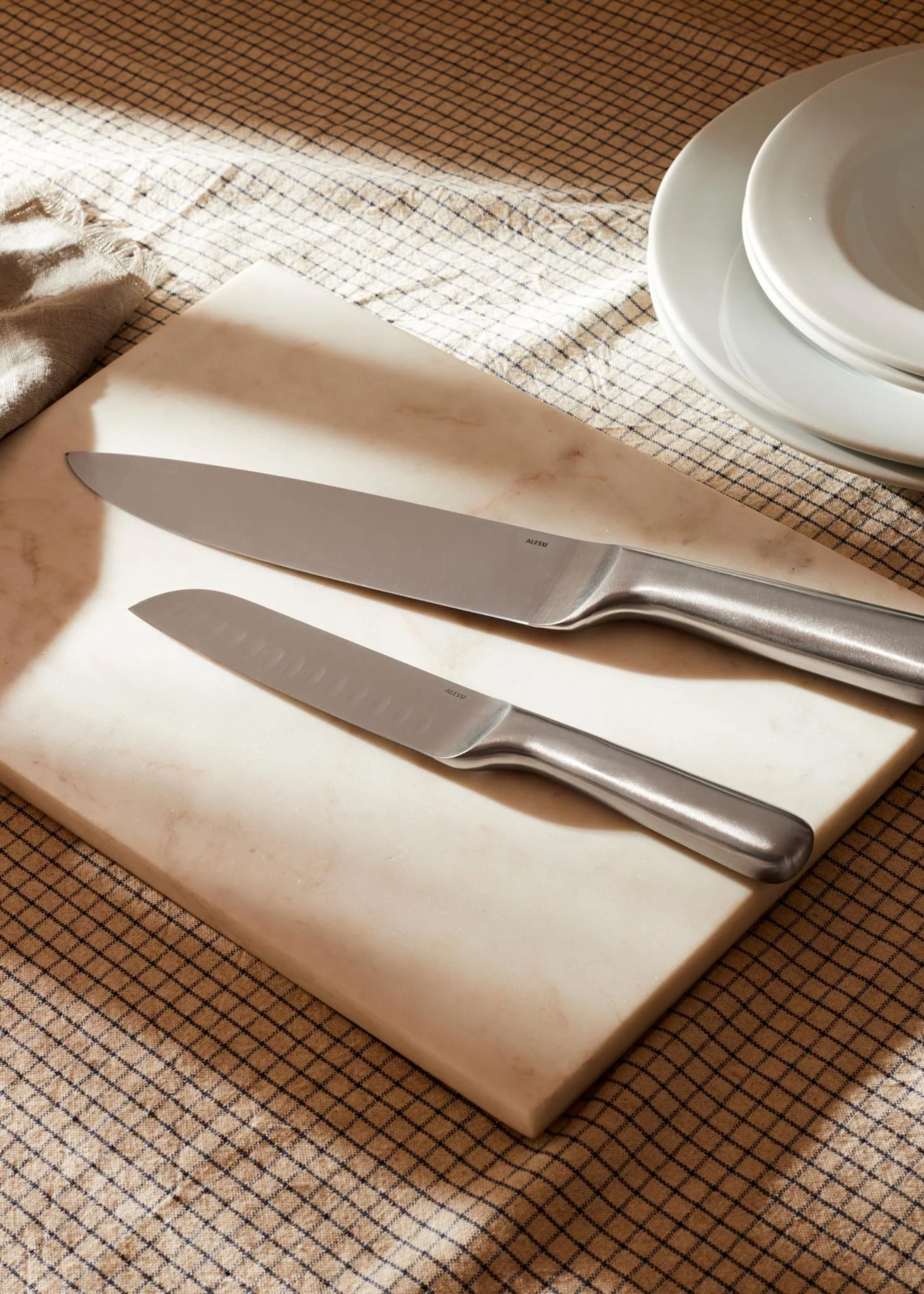 A set of knives on a cutting board