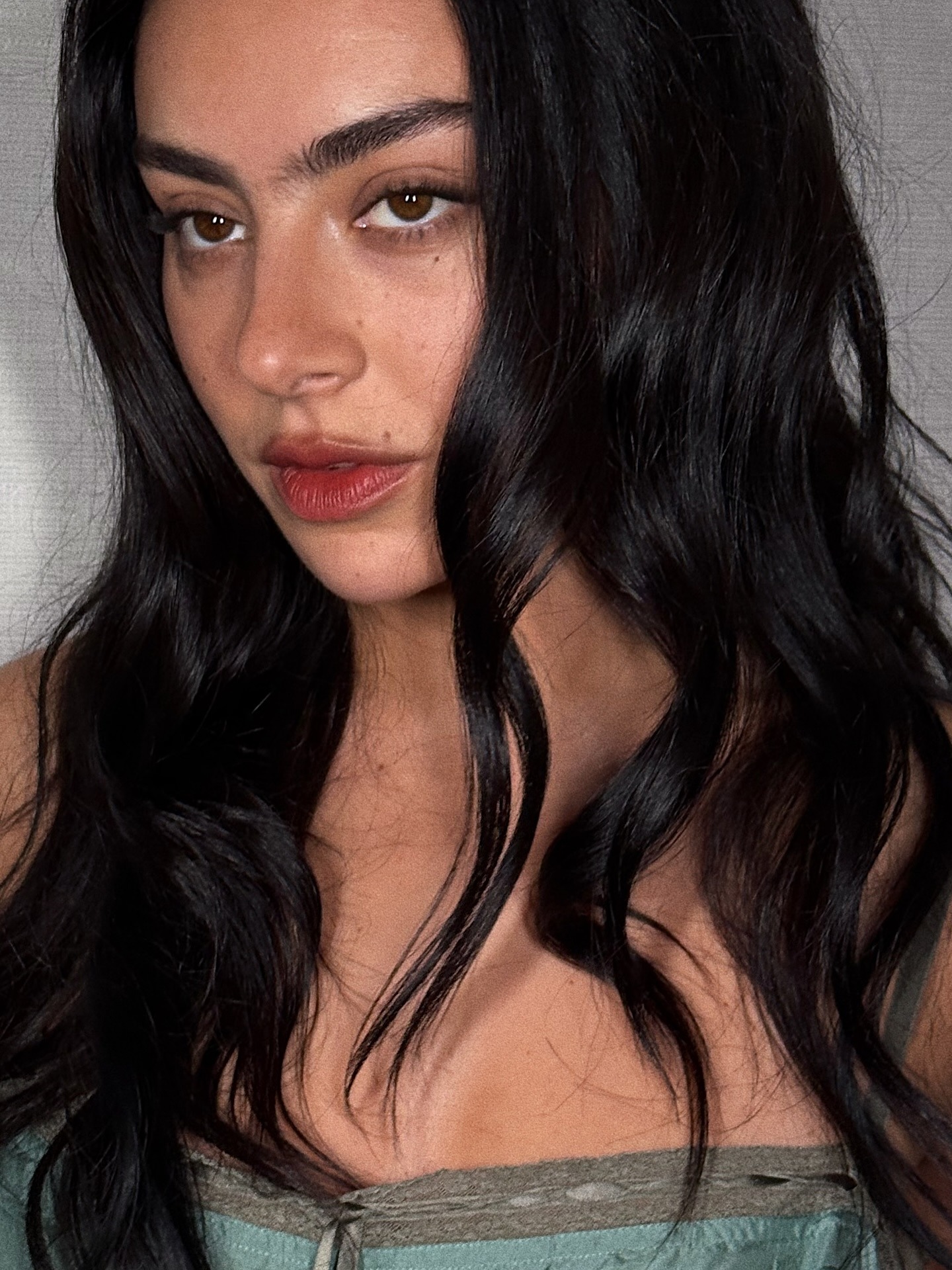 Charli XCX wearing a blurred lipstick